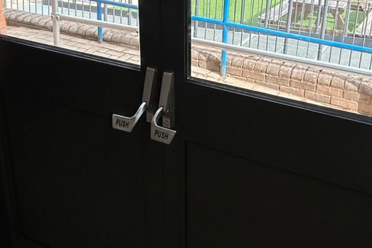 Emergency exit commercial door